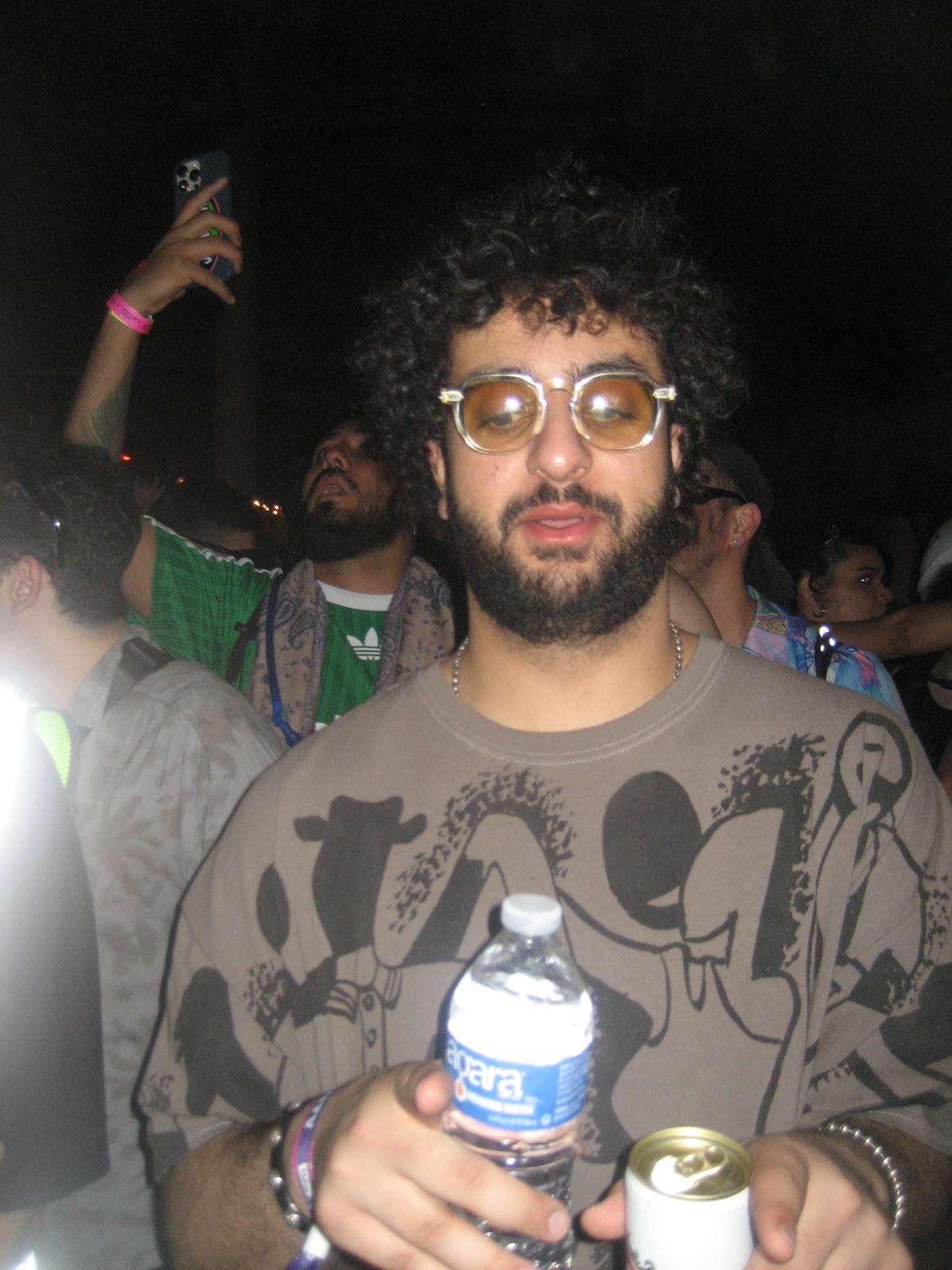 Hoodi in a crowd at night